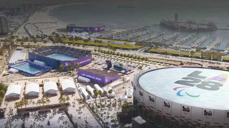 Aerial view of the Los Angeles 2028 Paralympic Games venue showing stadiums, sports arenas, and the waterfront area.